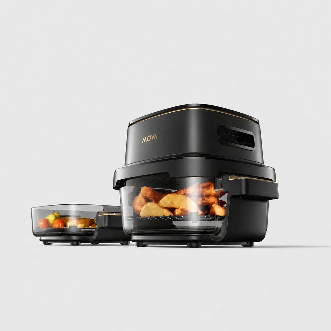 Compact air fryer with clear glass drawer open, showing roasted food and vents on side.