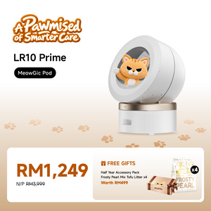 Pearl white enclosed smart pet litter box with a cat sitting inside the viewing window