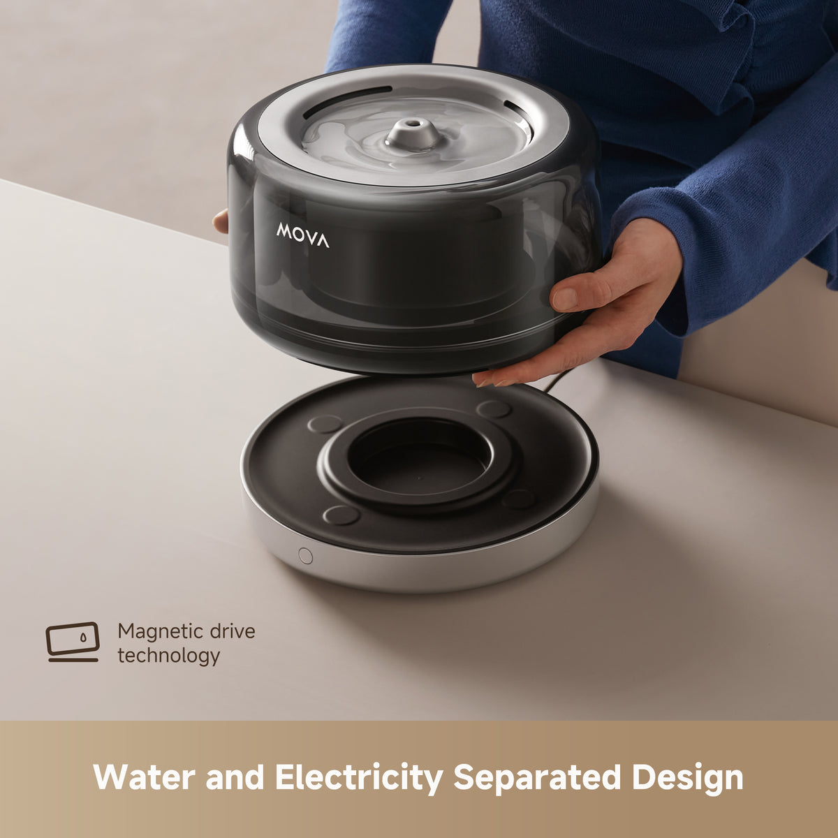 Pet water fountain with lid open and tray exposed, held by hands