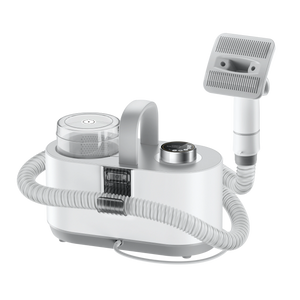 Pet grooming vacuum kit with white handheld unit, hose, and dual brush attachments